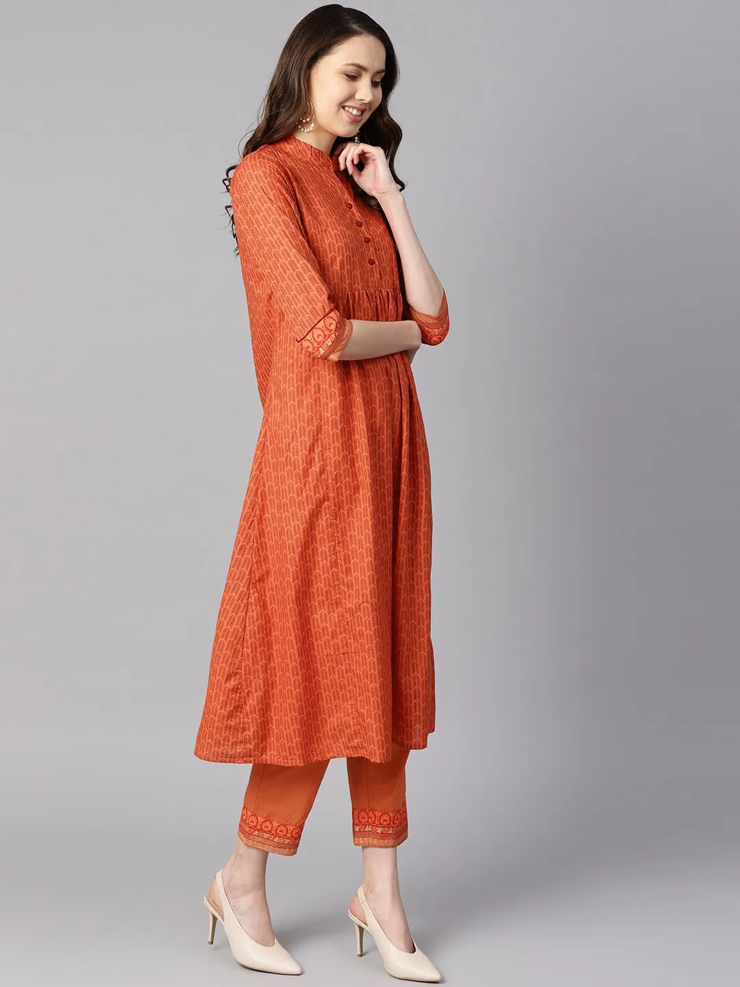 A Line Pleated Kurta With Border Detailing On The Sleeves With Straight Solid Pants